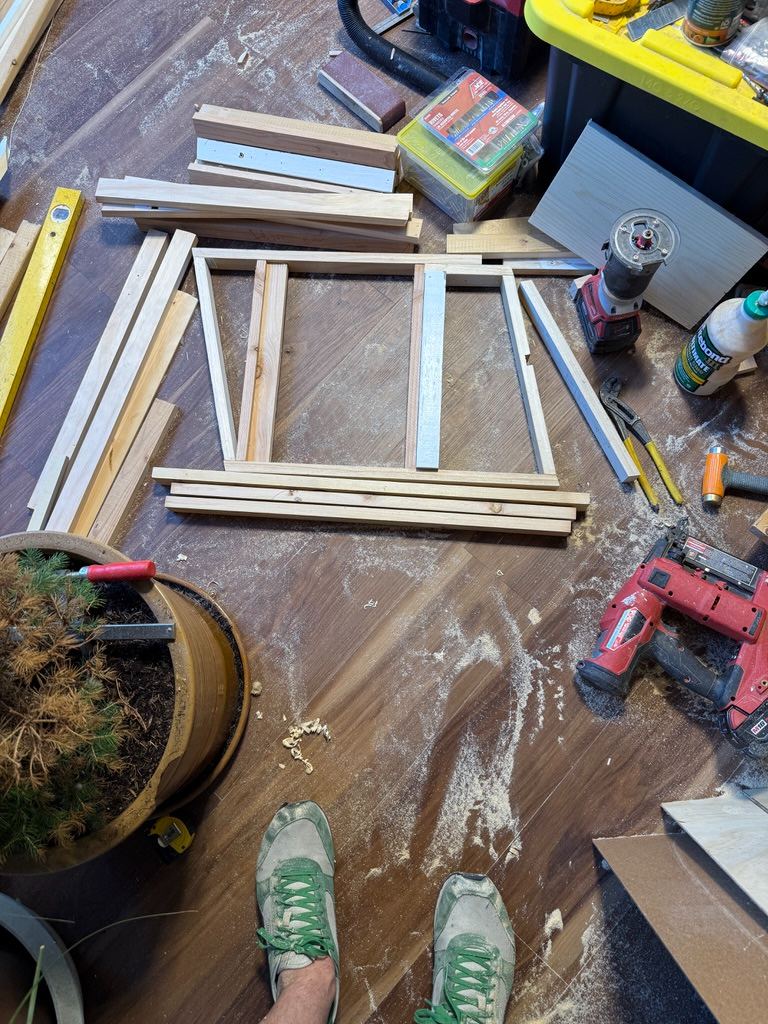 Bench parts laid out on the floor before assembly