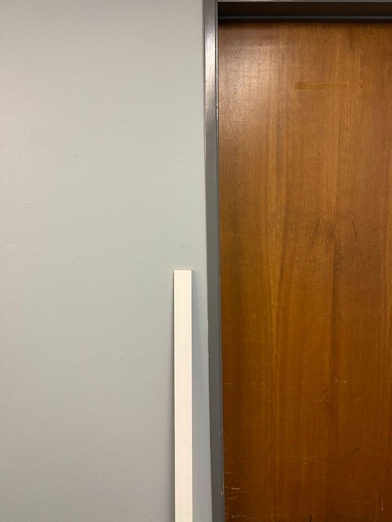 A length of door stop, cut to match the jamb